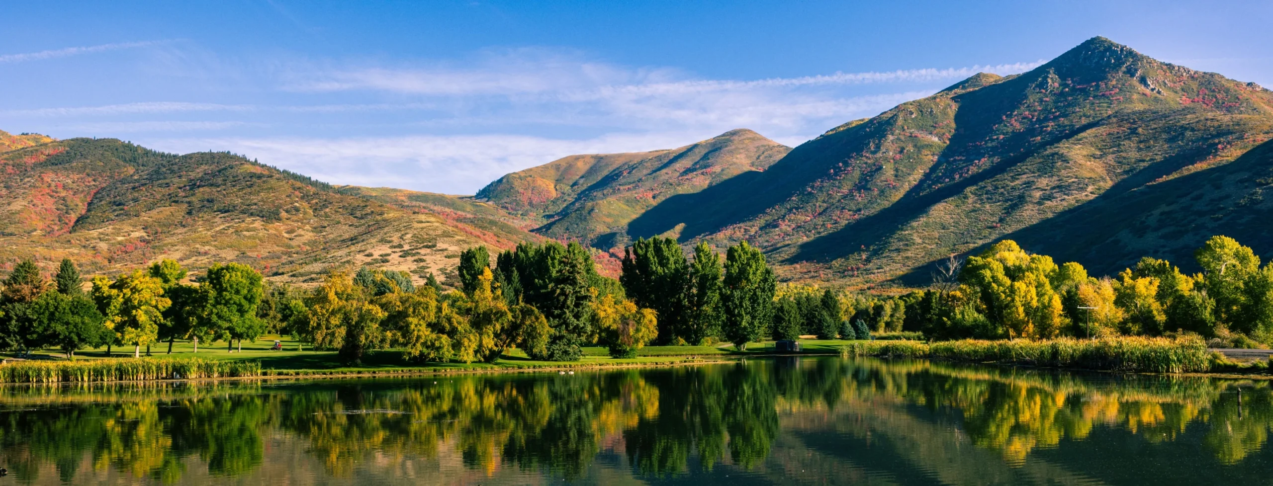 landscape picture of a mountain range with a body of water