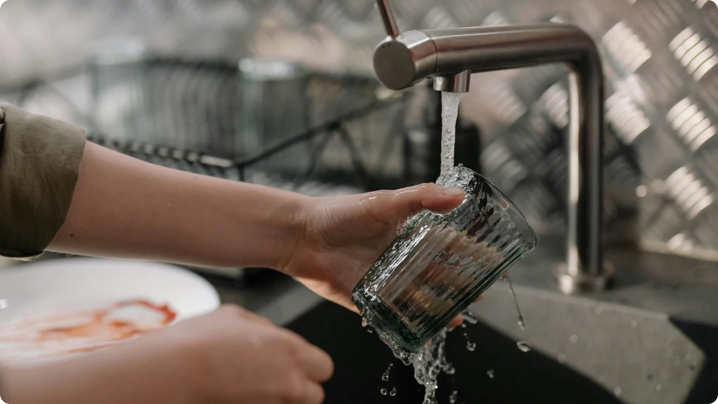 picture of a person washing a glass