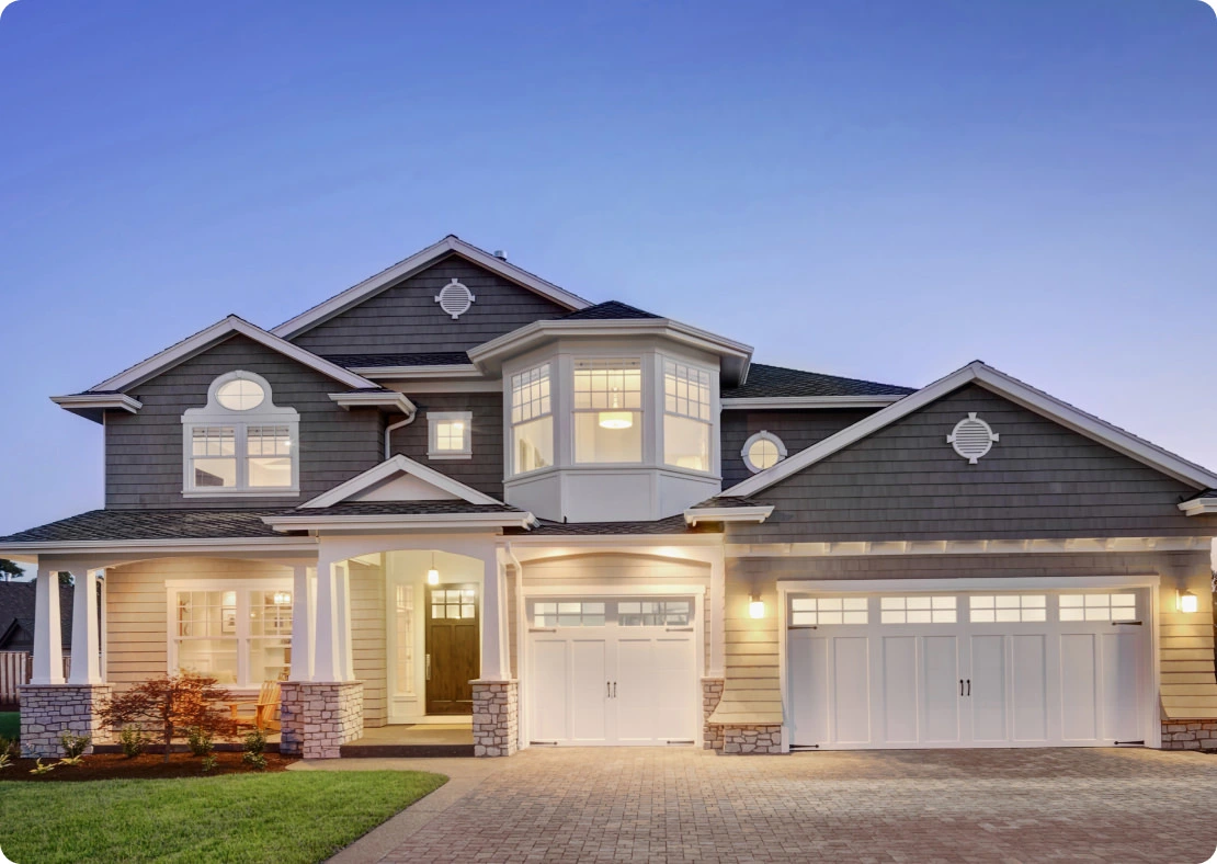 picture of a front of a house with lights on